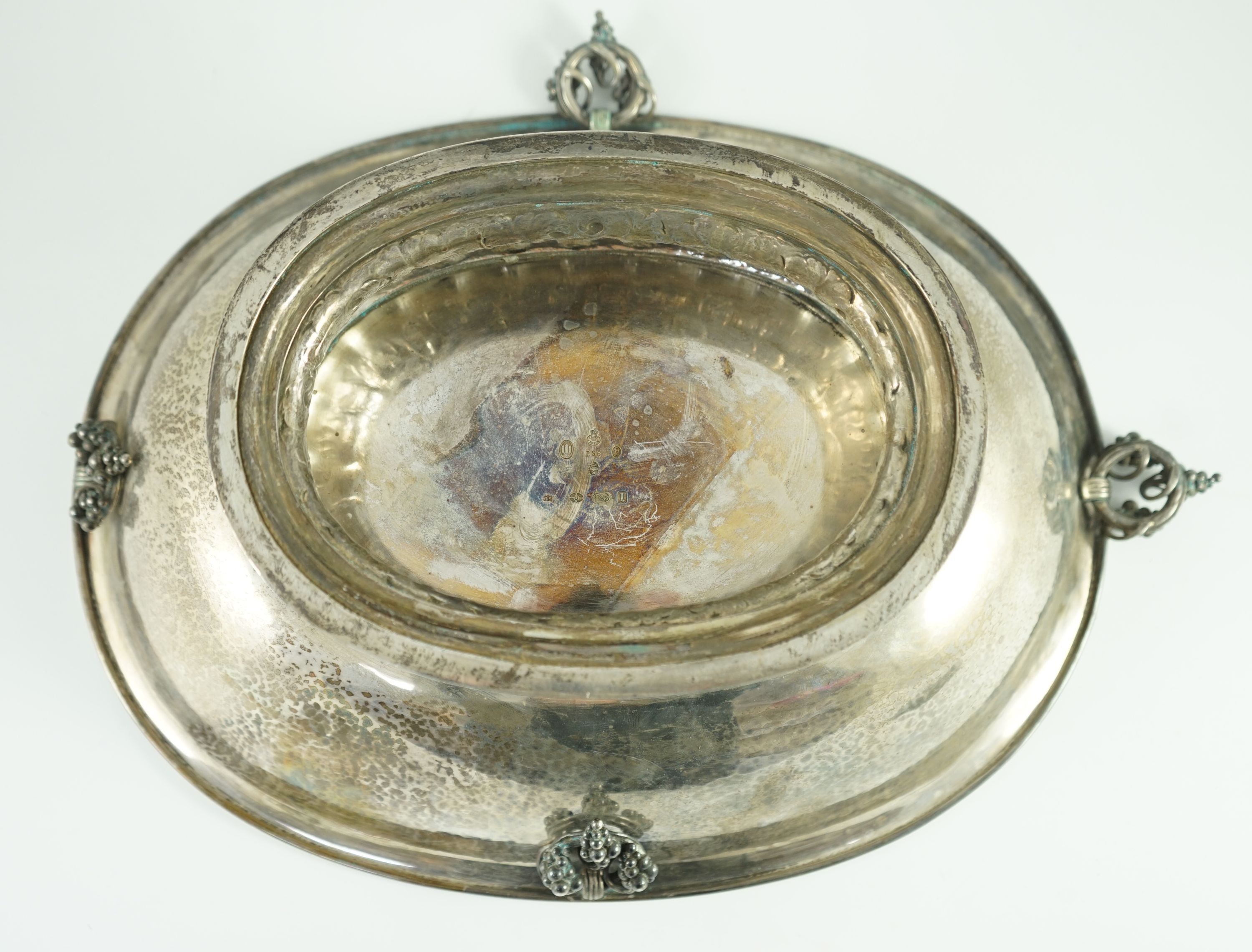 A good George V Georg Jensen planished silver Grape pattern oval pedestal fruit bowl, design no. 296
